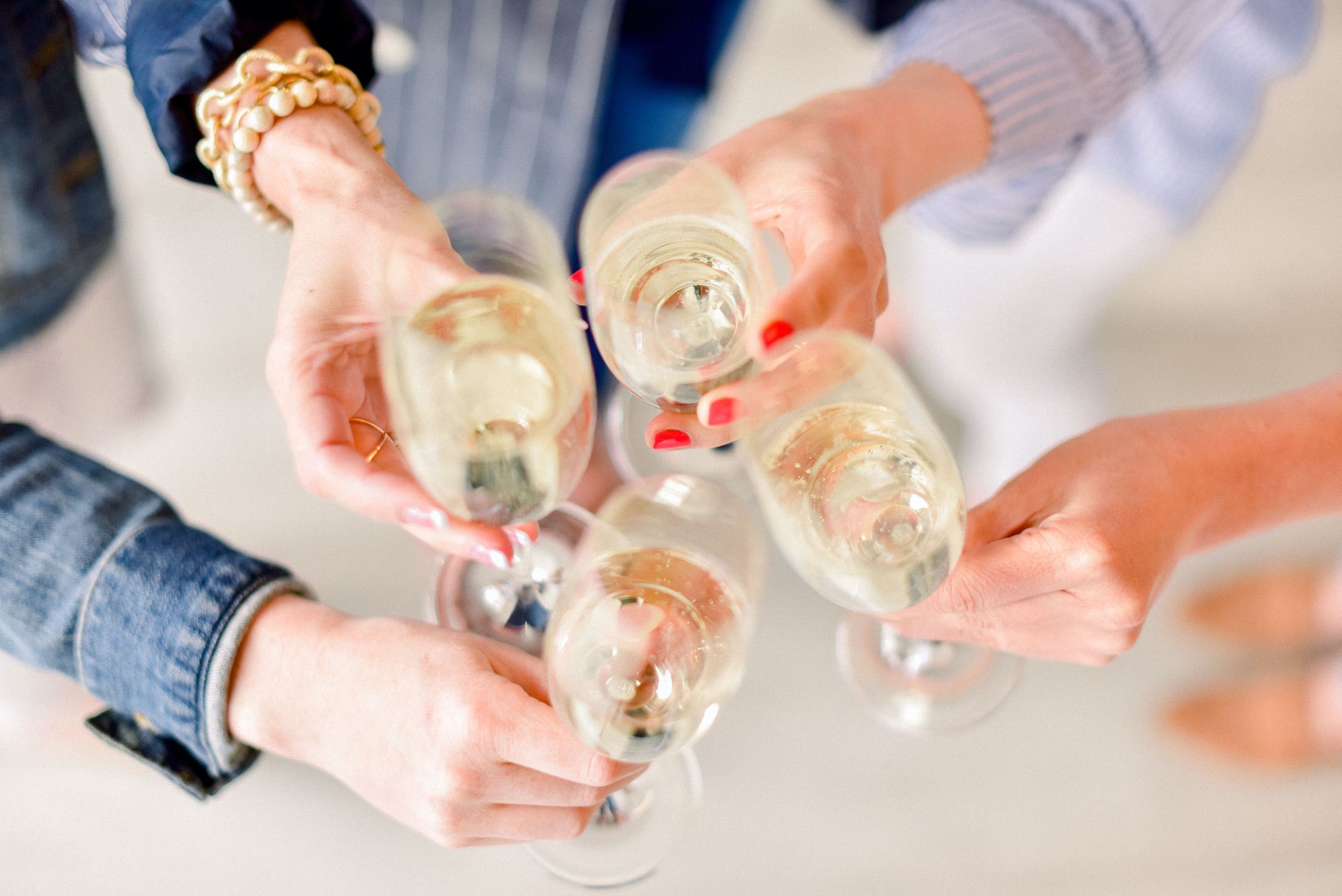 RPC employees cheering with champagne
